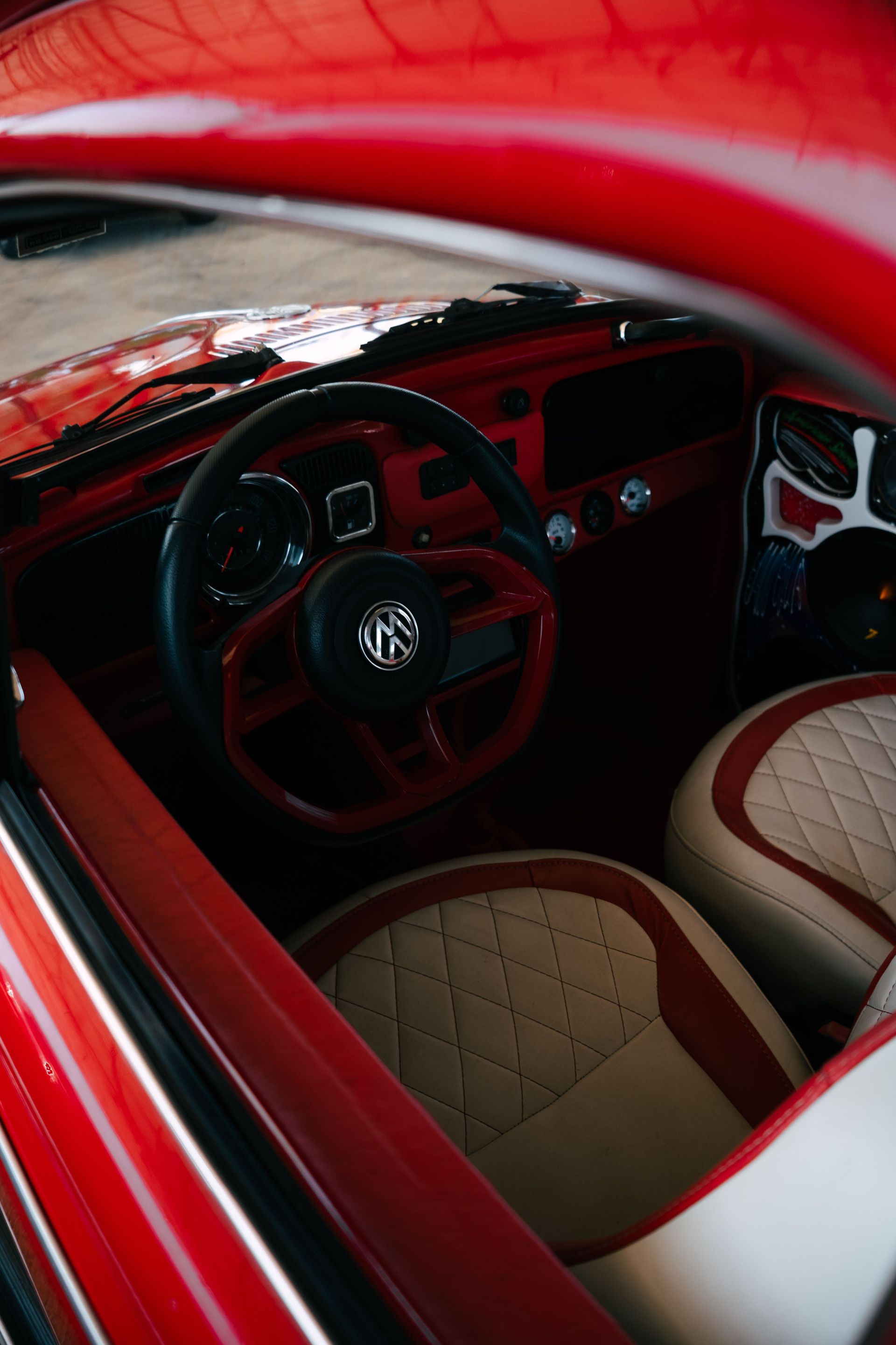 Explore a classic red car interior with retro styling, capturing the essence of nostalgia and vintage design.